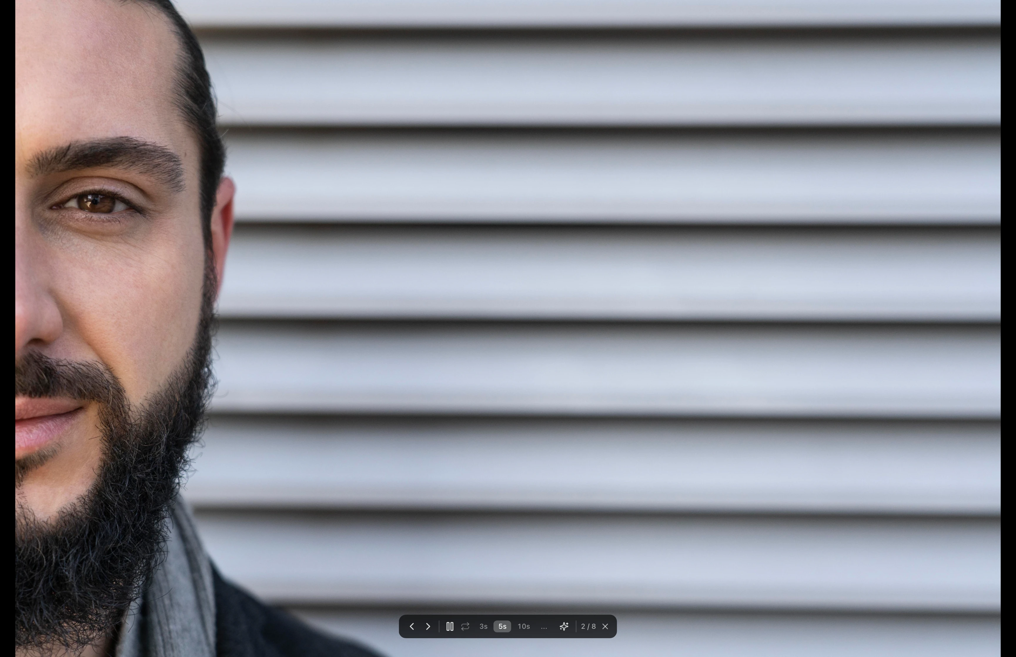 Full-screen slideshow playing with controls visible at the bottom